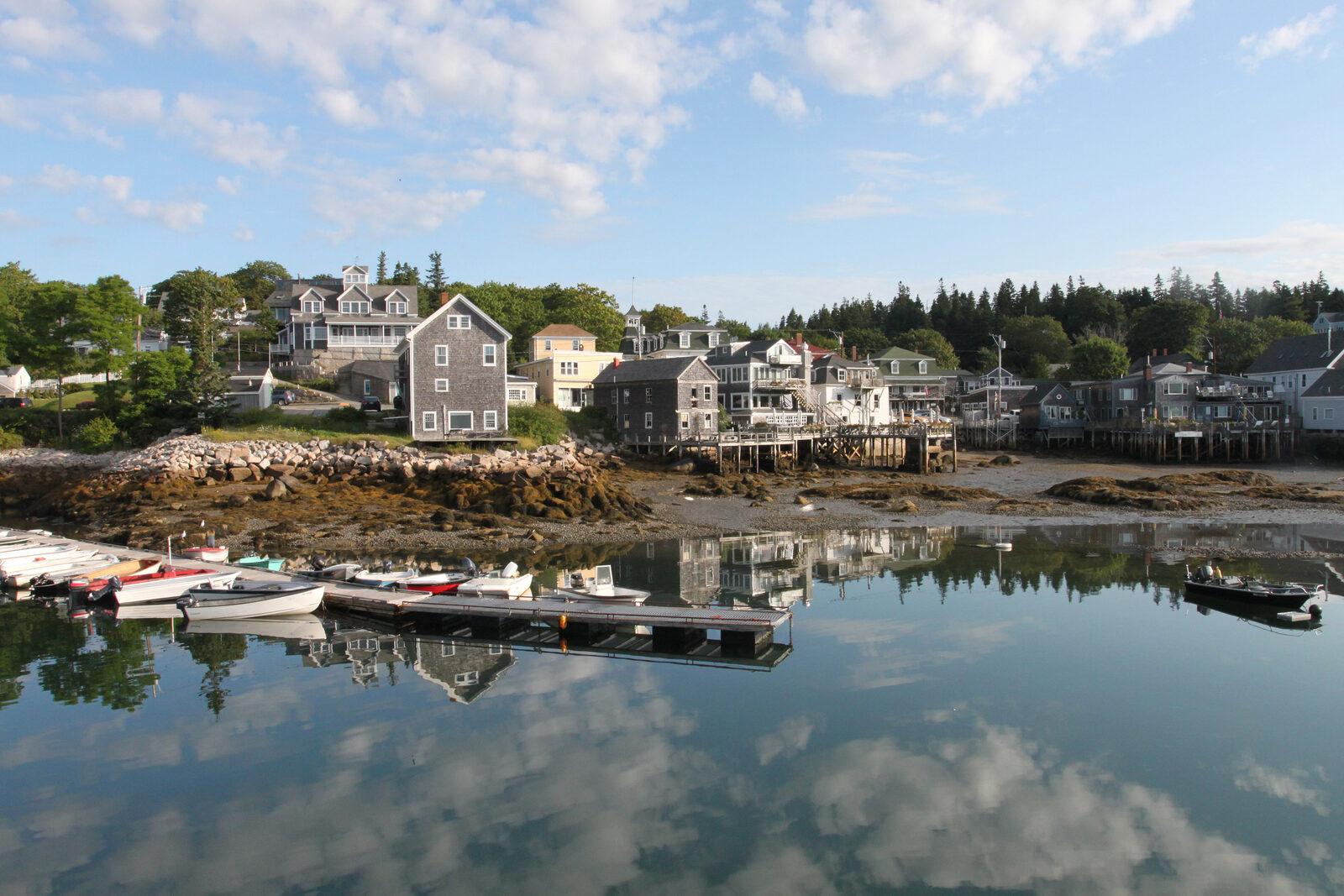 Stonington harbor at low tide with mirror reflections